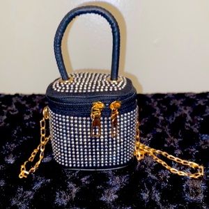 Mini hand purse with handle and gold crossbody chain